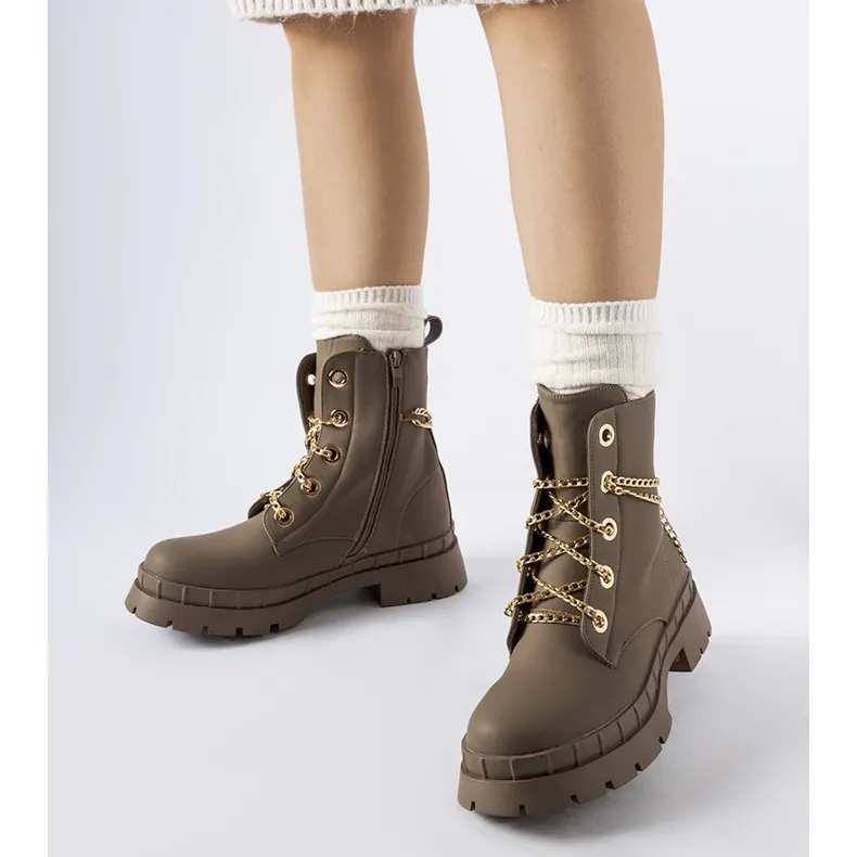 Brown hiking boots with Alcin chain