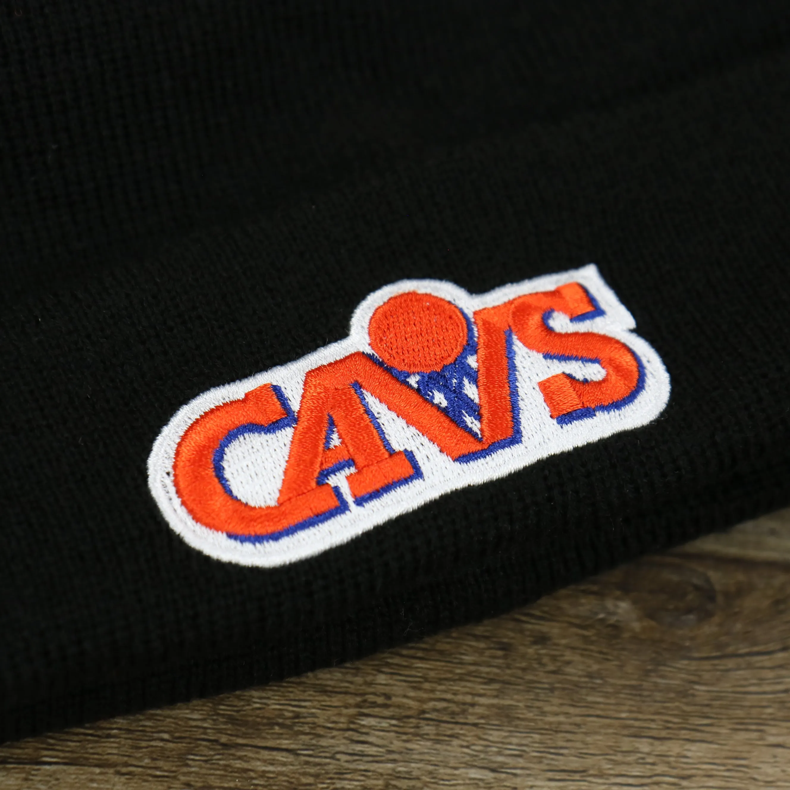 Cleveland Cavaliers Winter Beanie with Retro Logo Patch and Orange Pom Pom | Black