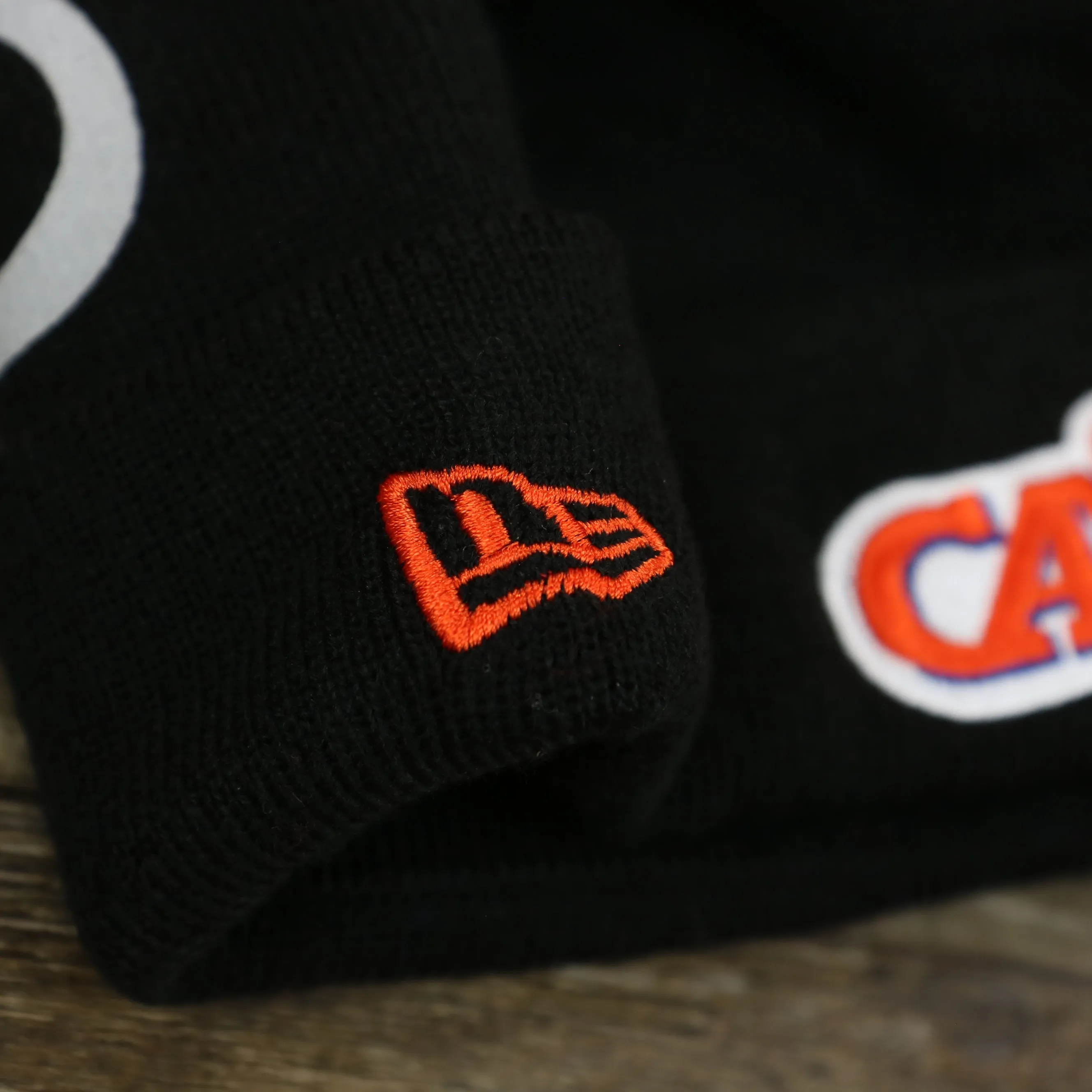 Cleveland Cavaliers Winter Beanie with Retro Logo Patch and Orange Pom Pom | Black