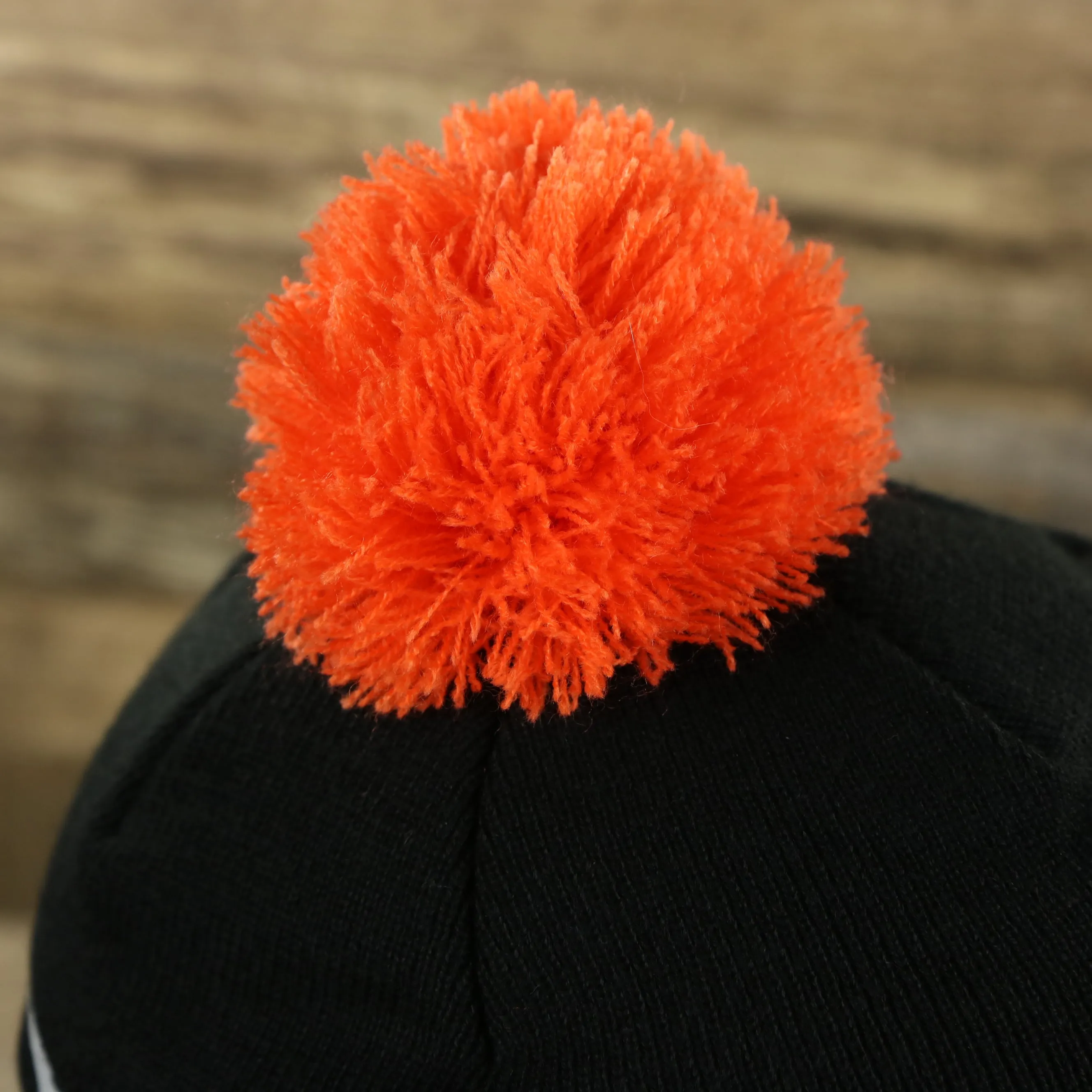 Cleveland Cavaliers Winter Beanie with Retro Logo Patch and Orange Pom Pom | Black